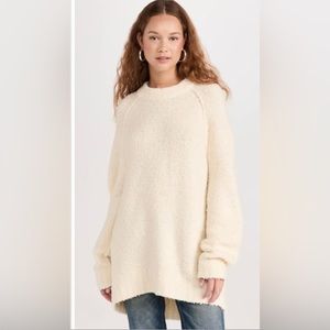 Cream sweater. Slits at the either side of the bottom.